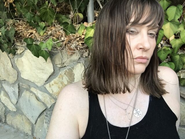 Wearing the sigil of Gabriel, the angel of writing.